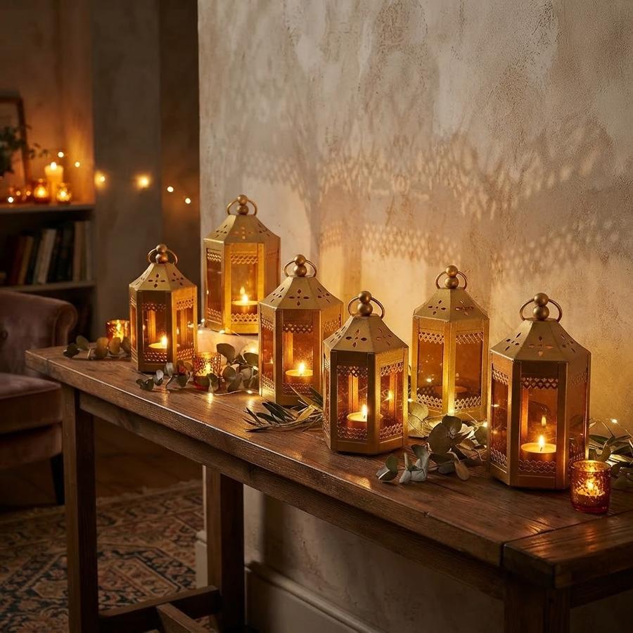 Gold mini tealight holders set out for a wedding table